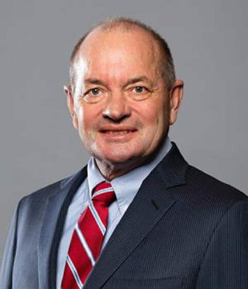 Headshot of man with red and white tie 