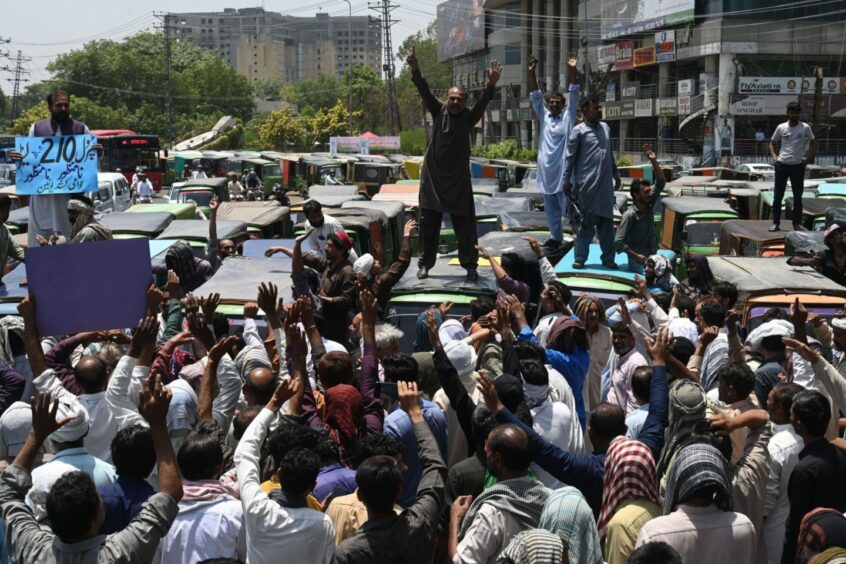 Autorickshaw drivers shout slogans during an anti-government demonstration to protest against inflation and fuel price hikes in Lahore, Pakistan, on June 3, 2022. Photographer: Arif Ali/AFP/Getty Images