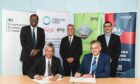 Secretary of State Kwasi Kwarteng observes the signing between Zainal Abidin Abd Jalil and Rob Fisher of Ping Petroleum with Dan Jackson of Cerulean Winds and Tan Sri Syed of DNeX.