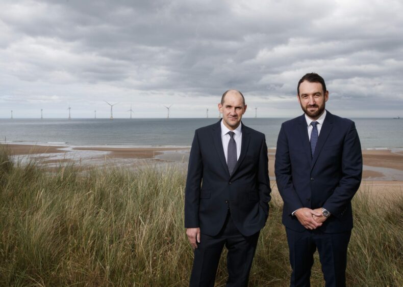 (L-R) PD&MS' energy transition strategy is led by Mark Davidson and Thomas Barter, pictured in front of Vattenfall's EOWDC.
