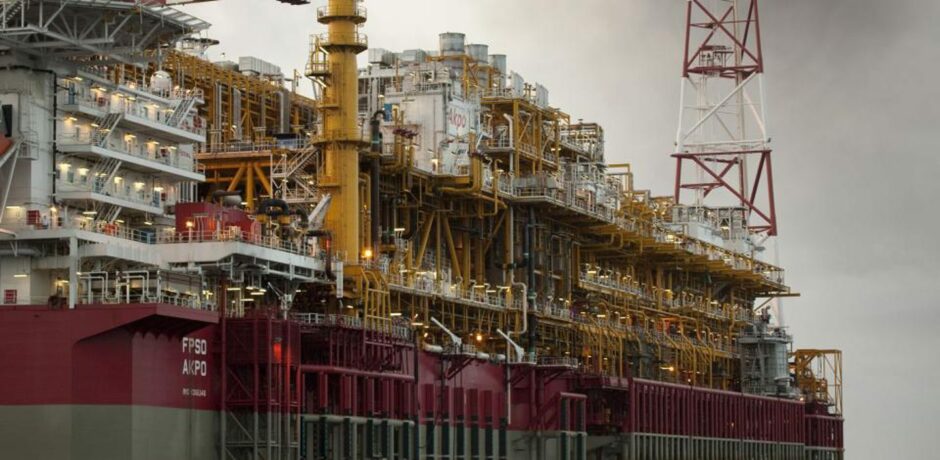 Side view of FPSO, with yellow and red equipment