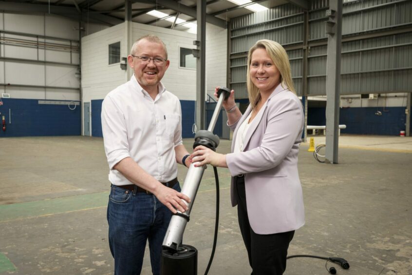 (L-R) Trojan Energy CEO Ian Mackenzie and Nicola Douglas, executive director at the Scottish National Investment Bank, with the firm's Aon system.