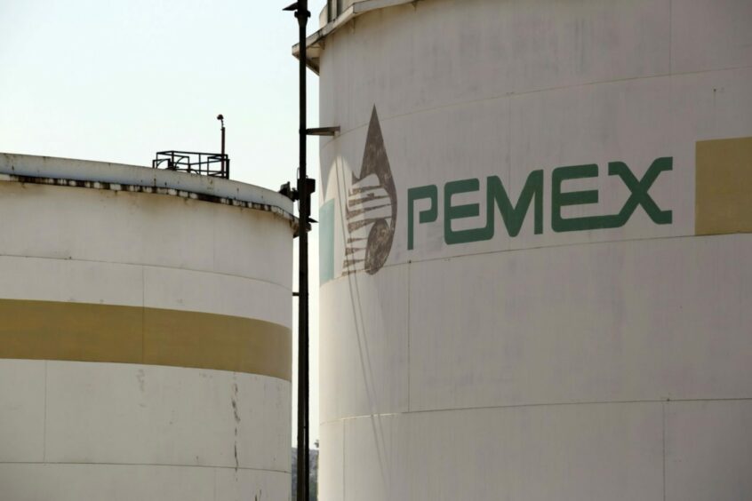 The Petroleos Mexicanos (Pemex) logo is displayed on a storage tank at the company's Miguel Hidalgo Refinery in Tula de Allende, Mexico, on Thursday, March 6, 2014.  Photographer: Susana Gonzalez/Bloomberg