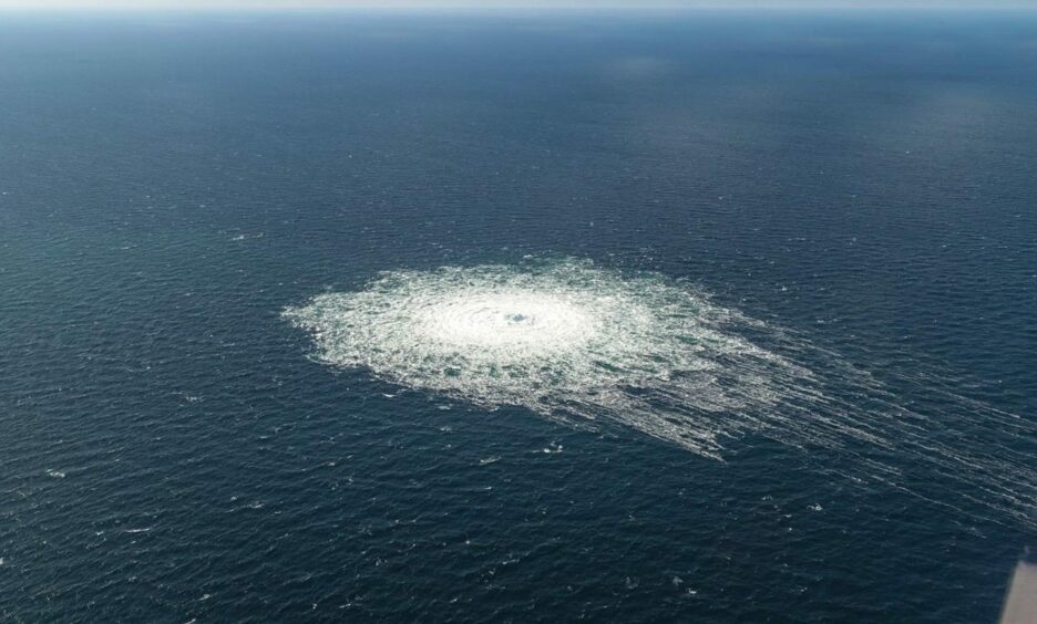 A gas leak bubbles up in the water