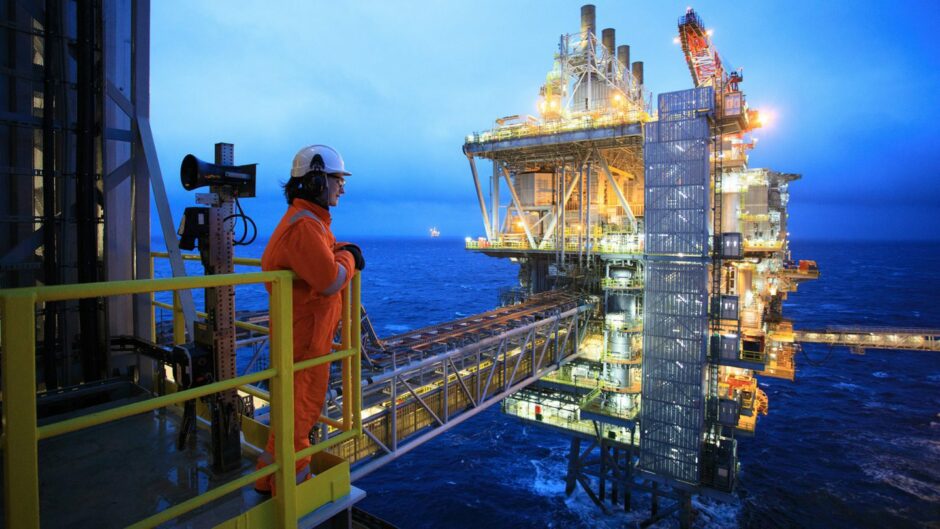 A  worker looks out from an oilfield off Shetland