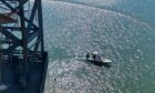 Boats search for the man in the La Quinta channel.