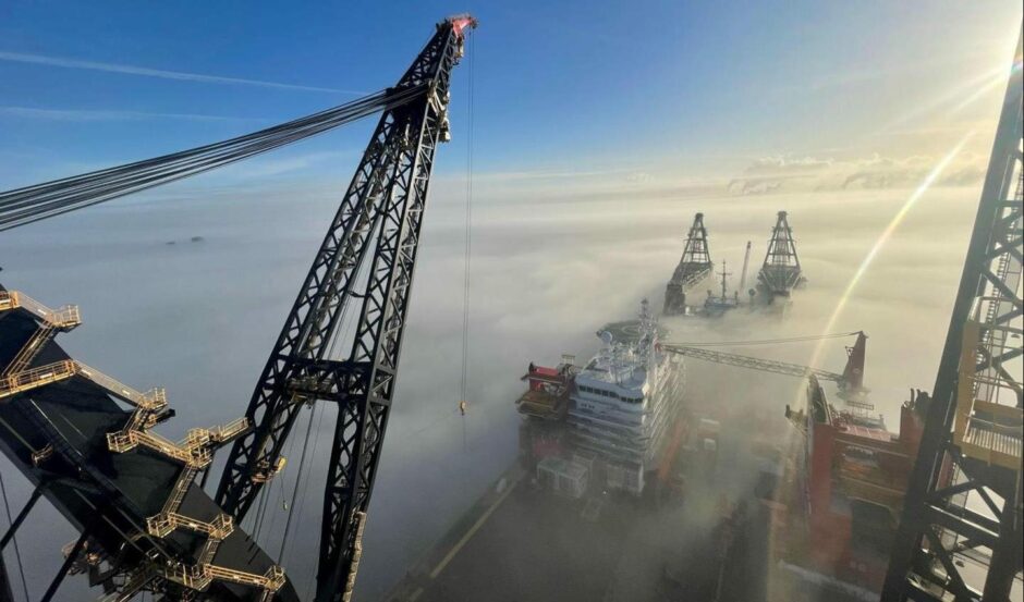 Heerema's Sleipnir and Thialf heavy lift vessels engulfed by cloud in Rotterdam.