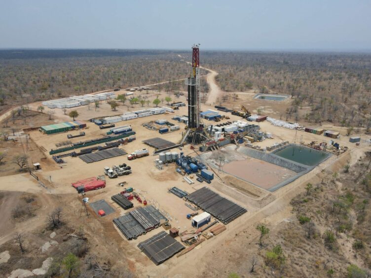 Drone shot of drill rig in arid landscape