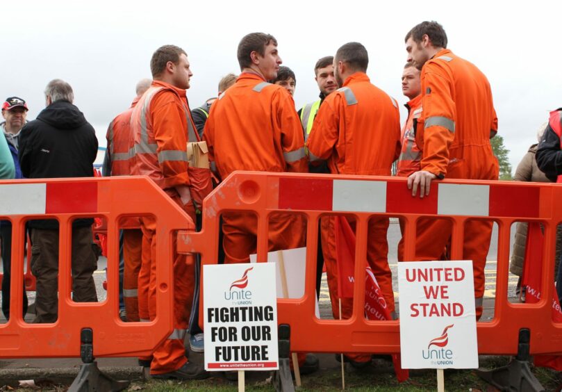 File photo of striking workers and Unite union members outside the Grangemouth oil refinery in 2013.