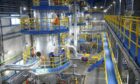 Inside an industrial facility, with blue and yellow colouring