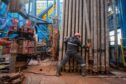 A worker moves drilling pipes at the Gazprom PJSC gas drilling rig in the Kovyktinskoye gas field, part of the Power of Siberia gas pipeline project, near Irkutsk, Russia, on Wednesday, April 7, 2021. Built by Russian energy giant Gazprom PJSC, the pipeline runs about 3,000 kilometers (1,864 miles) from the Chayandinskoye and Kovyktinskoye gas fields in the coldest part of Siberia to Blagoveshchensk, near the Chinese border.