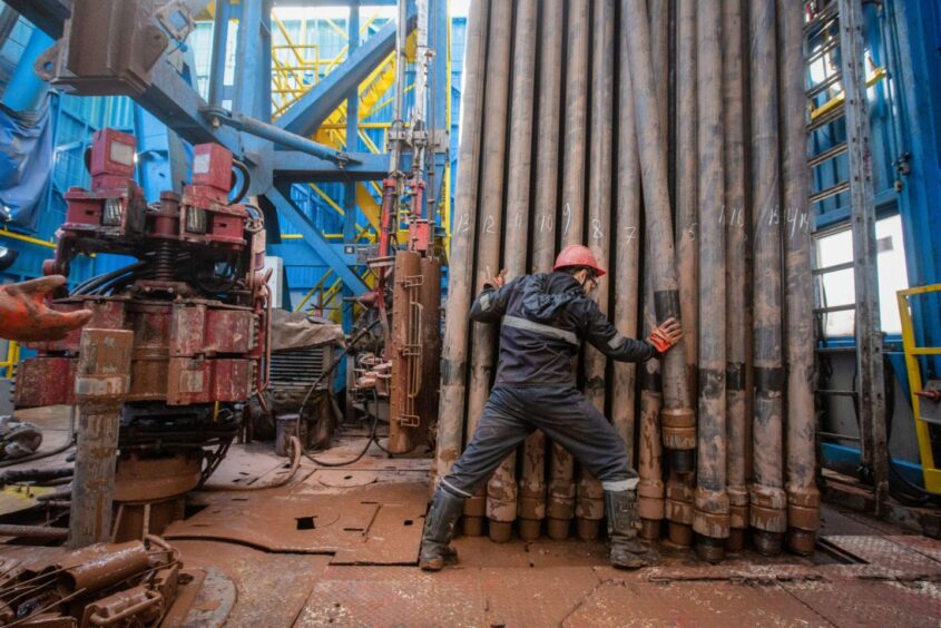 A worker moves drilling pipes at the Gazprom PJSC gas drilling rig in the Kovyktinskoye gas field, part of the Power of Siberia gas pipeline project, near Irkutsk, Russia, on Wednesday, April 7, 2021. Built by Russian energy giant Gazprom PJSC, the pipeline runs about 3,000 kilometers (1,864 miles) from the Chayandinskoye and Kovyktinskoye gas fields in the coldest part of Siberia to Blagoveshchensk, near the Chinese border.
