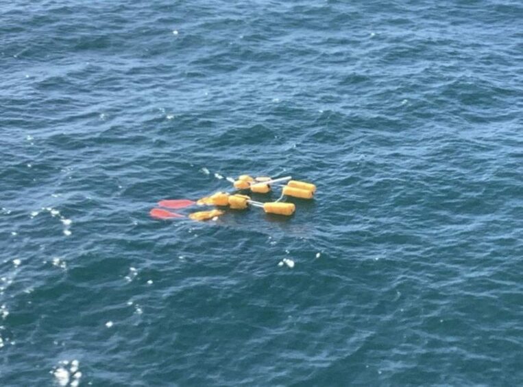 Floating yellow debris in the sea