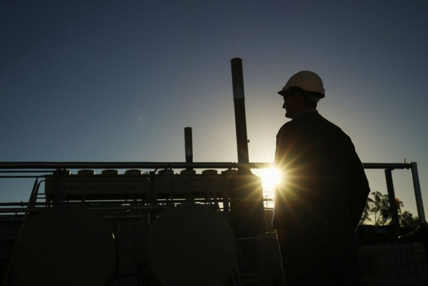 A Santos Ltd. operator looks on at the company's Wilga Park power station in Narrabri, Australia, on Thursday, May 25, 2017. Photographer: Brendon Thorne/Bloomberg