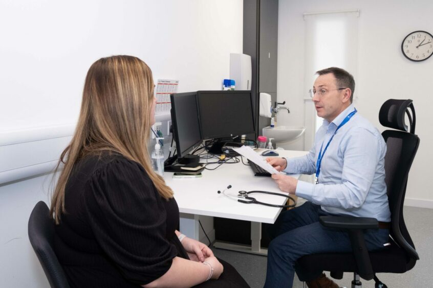 Patient assessment at UnitedHealthcare Global's new Aberdeen Occupational Health Services clinic.