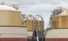 Storage tanks at Grain LNG importation terminal, operated by National Grid Plc, on the Isle of Grain, UK, on Monday, Aug. 22, 2022. The UK is about to receive liquefied natural gas from far-off Australia for the first time in at least six years, highlighting the European regions desperation in grappling with its worst energy crisis in decades. Photographer: Jason Alden/Bloomberg