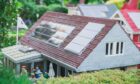 Billund, Denmark, July 2018: Solar panels on the roof of a toy house in Legoland