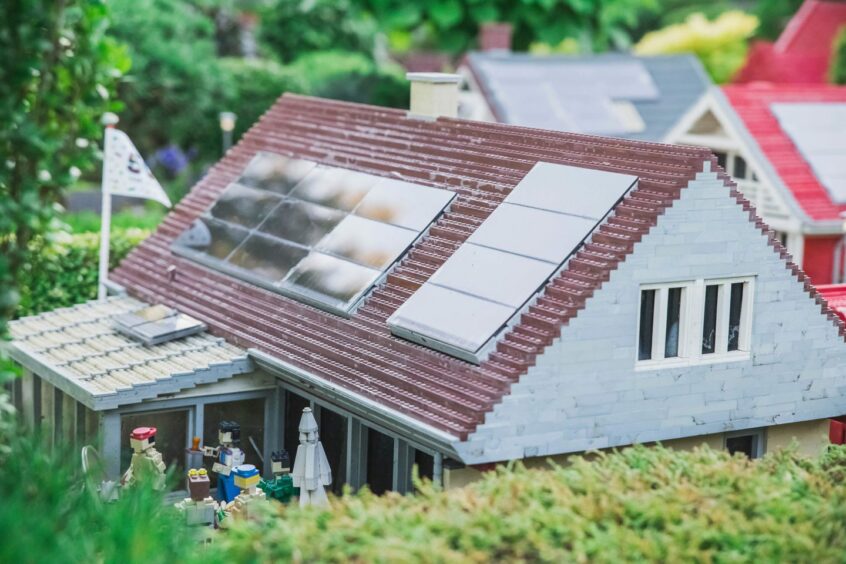 Billund, Denmark, July 2018: Solar panels on the roof of a toy house in Legoland