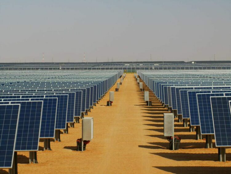 Solar panels against a desert backdrop.