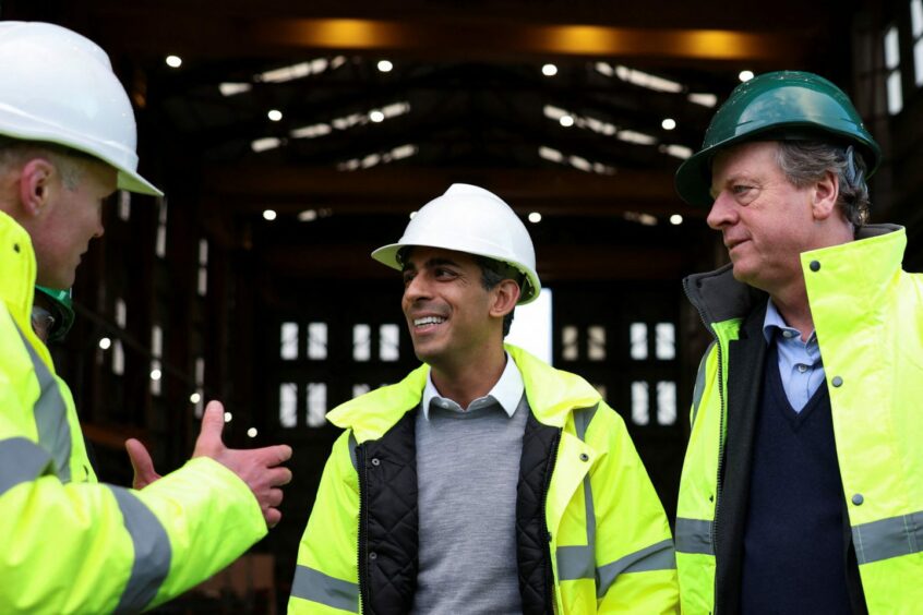 Prime Minister Rishi Sunak (centre) during a visit to the Port of Cromarty Firth, Invergordon