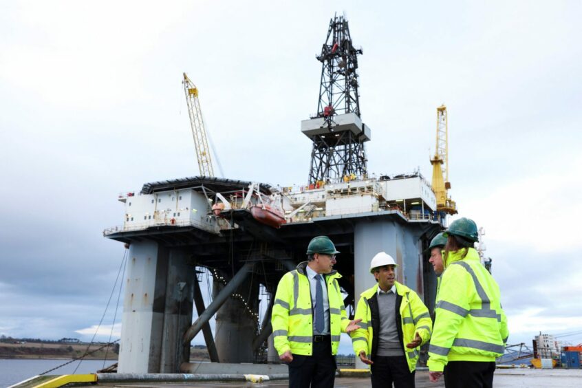 Prime Minister Rishi Sunak (second left) and Scottish Secretary Alister Jack (second right) during a visit to the Port of Cromarty Firth, Invergordon,