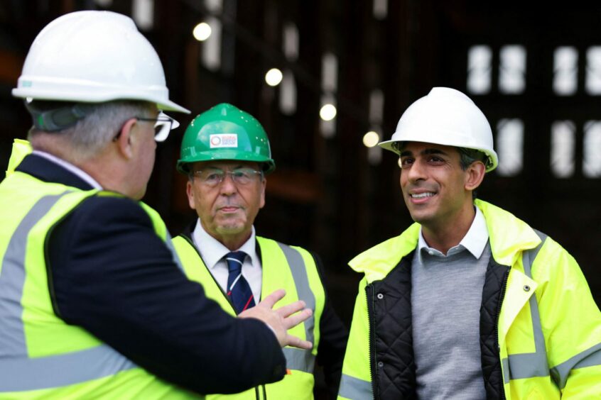 Prime Minister Rishi Sunak (right) during a visit to the Port of Cromarty Firth, Invergordon