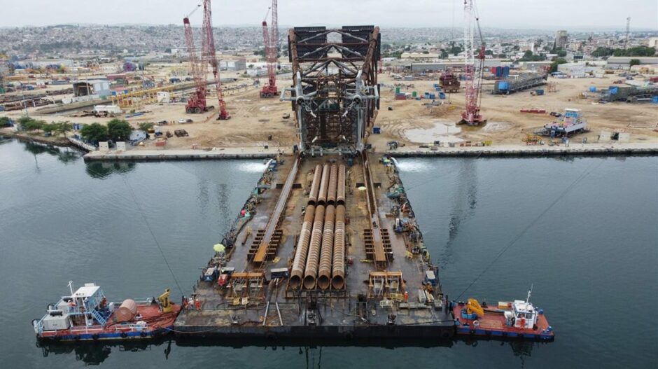 A massive jacket moves onto a barge