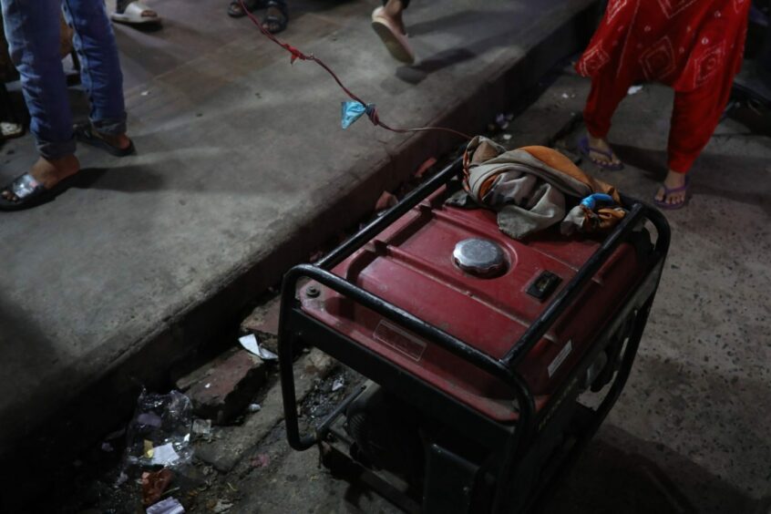 A generator provides power to a restaurant during the power outage in Dhaka, Bangladesh, on Tuesday, Oct. 4, 2022. Nearly half of Bangladesh was left without electricity on Tuesday after a transmission line tripped, discomforting citizens in the humid autumn weather. Photographer: Anik Rahman/Bloomberg