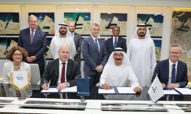 Representatives of Aker Solutions, DP World and Altera Infrastructure sign off on contracts for Knarr FPSO upgrading work.