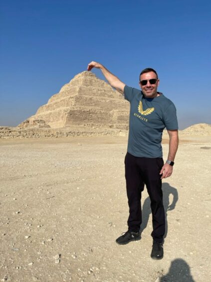 Andrew morrissey visiting the pyramids of Egypt