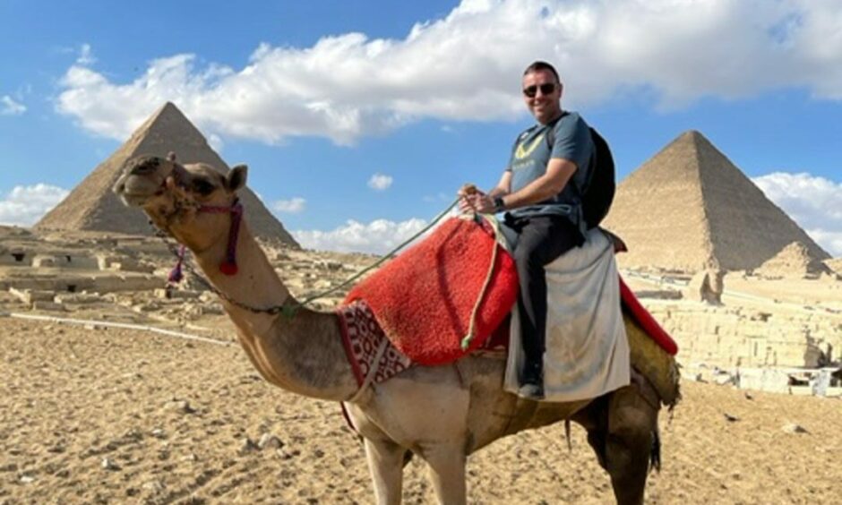 Andrew morrissey visiting the pyramids of Egypt