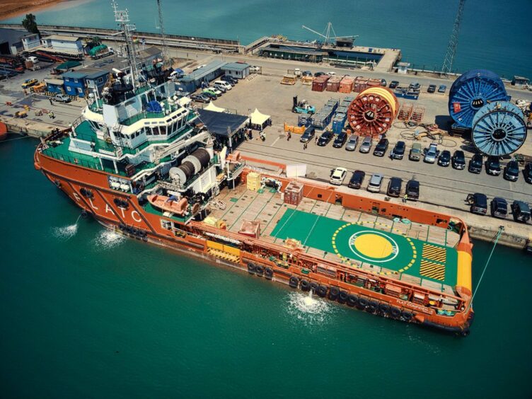 Supply boat moored at dock