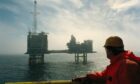 A worker looks onto BP's ETAP platform in the North Sea.