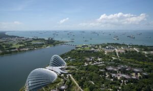 The Gardens by the Bay, bottom, stands as ships and tankers sit off the coast of Singapore on Monday, July 6, 2020.  Photographer: Wei Leng Tay/Bloomberg