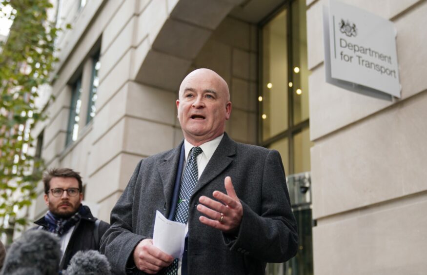 Mick Lynch, general secretary of the Rail, Maritime and Transport union (RMT), speaks to the media outside the Department for Transport offices in central London, Thursday November 24, 2022.