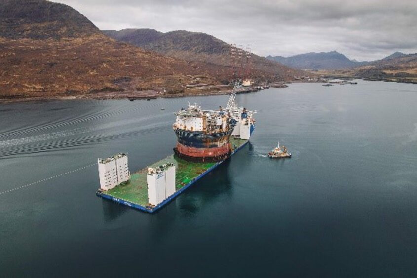 The Voyageur Spirit is floated onto the heavy load carrier Xin Yao Hua for its journey to the Middle East.