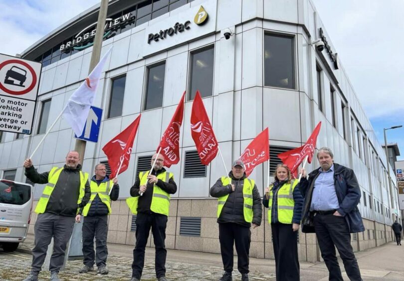 Unite the union and its members outside of Petrofac's Aberdeen offices during strike action