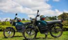 ARC Ride motorbikes in a green field