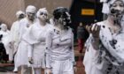 Activists dressed in white outside the APPEA conference in Adelaide