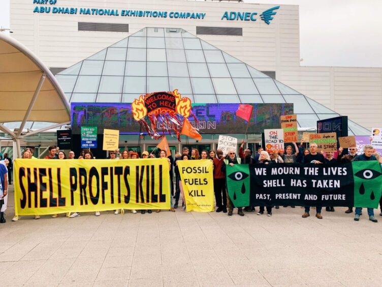 Protestors gather at Shell's AGM in London.