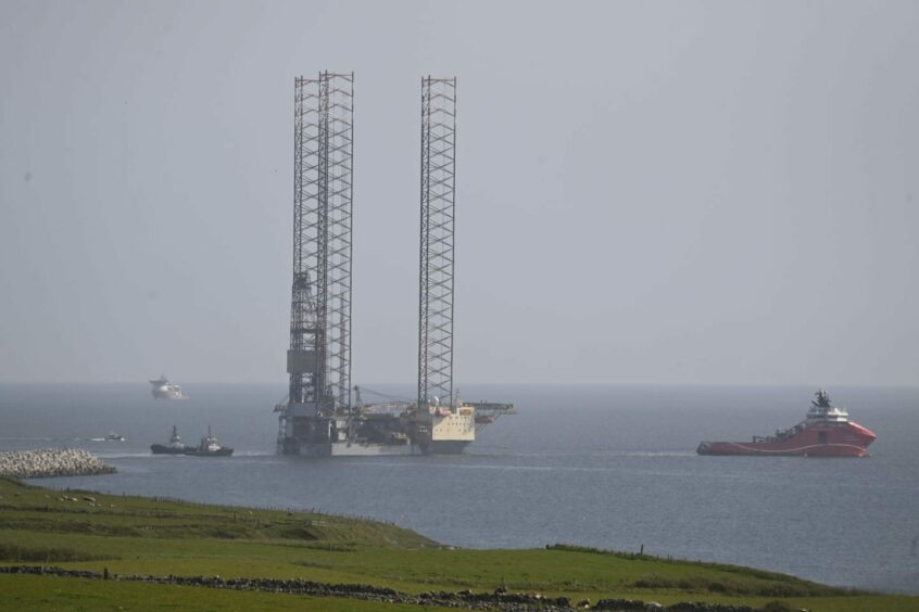 The Noble Innovator jack-up oil rig departing Aberdeen.