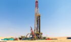 An Adnoc Drilling land rig in the desert