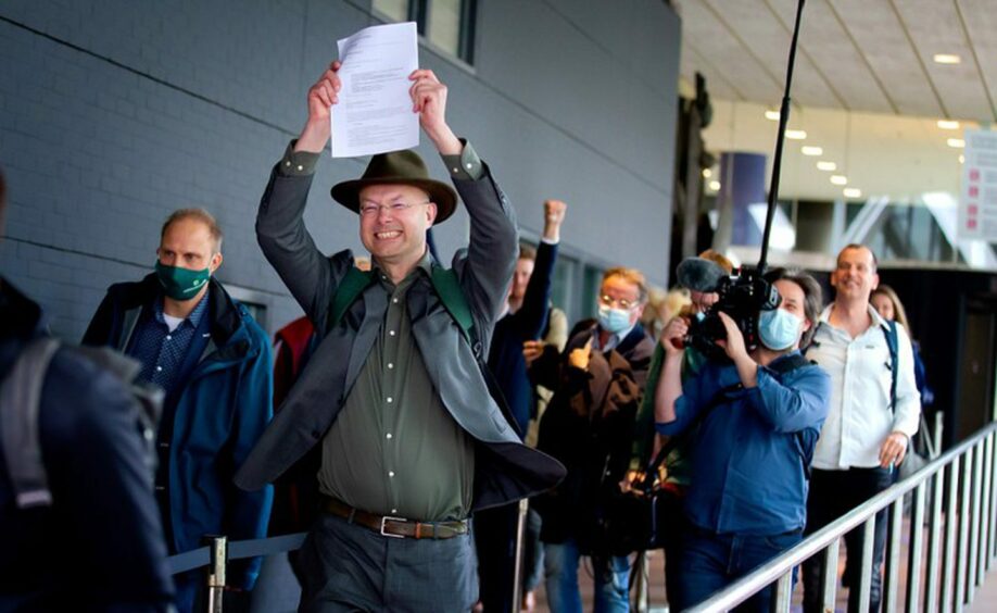 Climate campaigners celebrate the Hague court's decision to order Shell to cut its greenhouse gas emissions, including Scope 3, 45% by 2030.