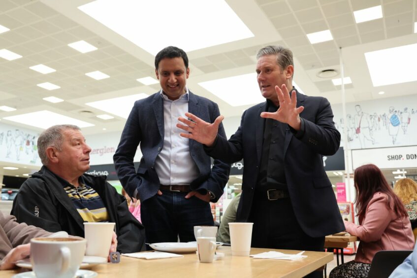 Labour leader Sir Keir Starmer  with Scottish Labour leader Anas Sarwar  during a visit to Rutherglen, South Lanarkshire, talking to locals. Picture date: Friday May 26, 2023.