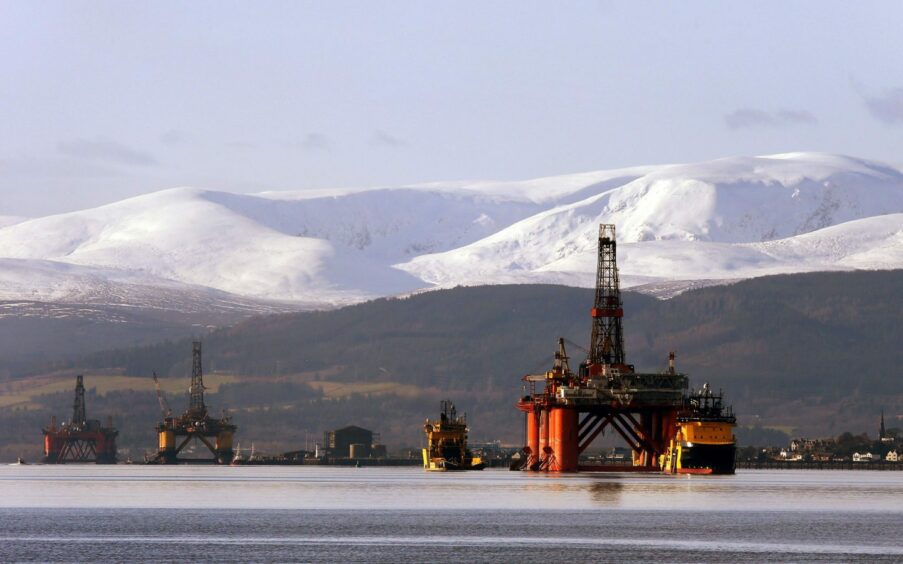 The oil platform Stena Spey is moved with tug boats amongst other rigs in the Cromarty Firth near Invergordon in the Highlands of Scotland.