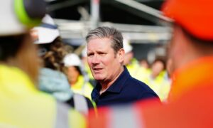 Labour leader Sir Keir Starmer talking to workers during a visit to Hinkley Point nuclear power station in Somerset