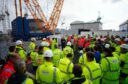 Labour leader Sir Keir Starmer (centre) talking to workers during a visit to Hinkley Point nuclear power station in Somerset