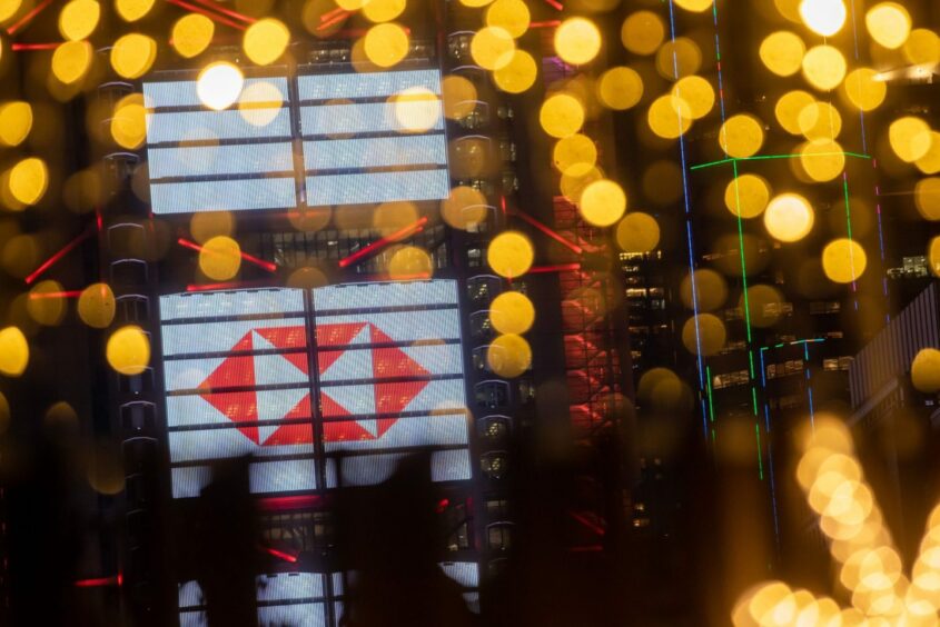 The HSBC Holdings Plc logo is displayed on the facade of the company's headquarters in Hong Kong, China, on Friday, Feb. 18, 2022. HSBC is scheduled to release earnings results on Feb. 22. Photographer: Paul Yeung/Bloomberg