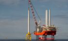 The Blue Tern vessel installs the first tower at the Neart na Gaoithe wind farm