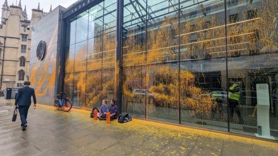 Pair of Just Stop Oil protestors "await arrest" after hitting the offices of the DESNZ with trademark orange paint.